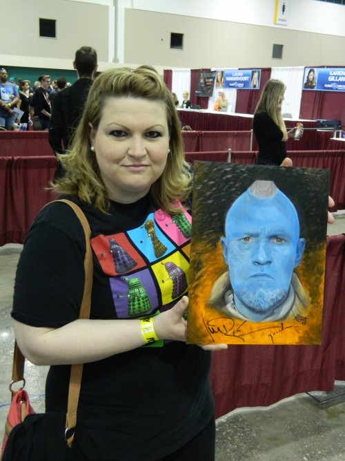 The artist with her signed painting
